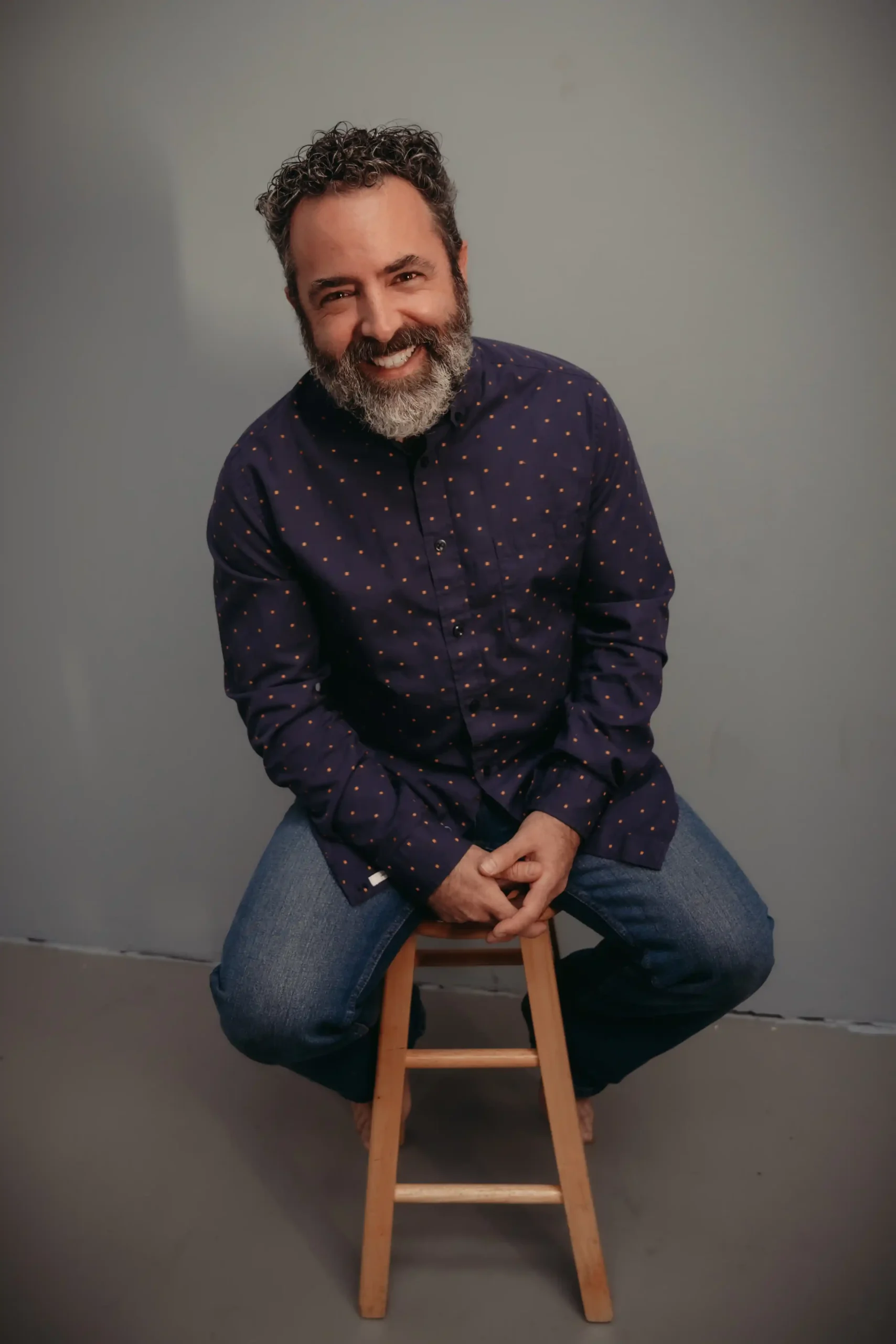 Chad image of Chad sitting on a wooden stool